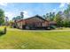 One-story home with a large sunroom and attached garage at 4045 Jason St, New Smyrna Beach, FL 32168