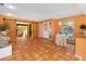 Open living space featuring terracotta floors and barn doors at 4045 Jason St, New Smyrna Beach, FL 32168