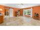 Living room with bay window and terracotta tile floors at 4045 Jason St, New Smyrna Beach, FL 32168