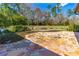 Spacious flagstone patio, perfect for outdoor entertaining, surrounded by lush landscaping at 4045 Jason St, New Smyrna Beach, FL 32168