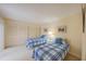 Guest bedroom with two twin beds and light walls at 4150 S Atlantic Ave # 112C, New Smyrna Beach, FL 32169