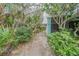 Condo unit's entrance with lush landscaping and walkway at 4150 S Atlantic Ave # 112C, New Smyrna Beach, FL 32169