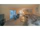 Living room features sectional sofa and view of kitchen at 4150 S Atlantic Ave # 112C, New Smyrna Beach, FL 32169