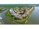 Stunning aerial view of a sprawling waterfront community featuring condos and boat docks at 432 Bouchelle Dr # 403, New Smyrna Beach, FL 32169