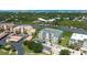 An aerial view showcasing multi-story building, boat docks, and assigned parking at 432 Bouchelle Dr # 403, New Smyrna Beach, FL 32169