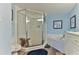 Bathroom featuring a glass enclosed shower, soaking tub, and neutral color palette at 432 Bouchelle Dr # 403, New Smyrna Beach, FL 32169