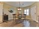 Cozy dining area features wood-look floors, a wine cooler, and seating for four at 432 Bouchelle Dr # 403, New Smyrna Beach, FL 32169