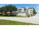 Multi-story building with a manicured green lawn in a quiet location at 432 Bouchelle Dr # 403, New Smyrna Beach, FL 32169