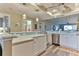 Bright kitchen featuring white cabinetry, quartz countertops, and stainless steel appliances at 432 Bouchelle Dr # 403, New Smyrna Beach, FL 32169