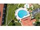 Aerial view of a resort-style pool, jacuzzi and surrounding amenities within the community at 432 Bouchelle Dr # 403, New Smyrna Beach, FL 32169