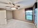 Bedroom with ceiling fan and window seat at 439 Bouchelle Dr # 202, New Smyrna Beach, FL 32169