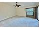 Bright bedroom with carpeted floor and ceiling fan at 439 Bouchelle Dr # 202, New Smyrna Beach, FL 32169