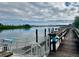 Community boardwalk leads to waterfront dock with boat slips and access ramp at 439 Bouchelle Dr # 202, New Smyrna Beach, FL 32169