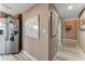 Hallway with light walls and wood-look flooring at 4650 Links Village Dr # D703, Ponce Inlet, FL 32127