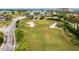 Landscaped putting green with sand traps at 4650 Links Village Dr # D703, Ponce Inlet, FL 32127