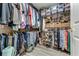 Large walk-in closet with ample hanging space and shelving at 4650 Links Village Dr # D703, Ponce Inlet, FL 32127