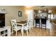 Charming dining area with white table and chairs at 4799 S Atlantic Ave # 3030, Ponce Inlet, FL 32127