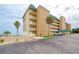 Oceanfront condo building with parking and tropical landscaping at 4799 S Atlantic Ave # 3030, Ponce Inlet, FL 32127