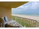 Relaxing balcony with ocean views and comfortable seating for two at 4799 S Atlantic Ave # 3030, Ponce Inlet, FL 32127