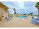 Inviting outdoor pool area with lounge chairs and patio tables at 4799 S Atlantic Ave # 3030, Ponce Inlet, FL 32127