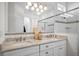 Double vanity bathroom with granite countertop and a large mirror at 508 Campana St, New Smyrna Beach, FL 32168