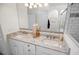 Double vanity bathroom with granite countertop and decorative vases at 508 Campana St, New Smyrna Beach, FL 32168