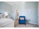 Bright bedroom with ensuite bathroom access and sitting area at 508 Campana St, New Smyrna Beach, FL 32168