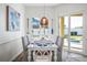 Casual dining area with sliding glass doors leading to backyard at 508 Campana St, New Smyrna Beach, FL 32168