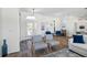 Bright entryway with wood-look tile and seating at 508 Campana St, New Smyrna Beach, FL 32168