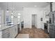 Modern kitchen with white cabinets, a large island, and stainless steel appliances at 508 Campana St, New Smyrna Beach, FL 32168