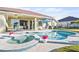 Luxury pool and spa with patio furniture and lush landscaping at 508 Campana St, New Smyrna Beach, FL 32168