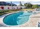 Freeform swimming pool with a spa and light-colored tile at 508 Campana St, New Smyrna Beach, FL 32168