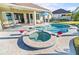 Relaxing freeform pool and spa with outdoor seating at 508 Campana St, New Smyrna Beach, FL 32168