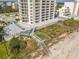 Beachfront property showing walkway to beach and building amenities at 5207 S Atlantic Ave # 1021, New Smyrna Beach, FL 32169