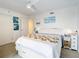 Bedroom with coastal decor and a large bed at 5207 S Atlantic Ave # 1021, New Smyrna Beach, FL 32169