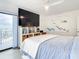 Main bedroom with king bed, built-in shelving, and ocean view at 5207 S Atlantic Ave # 1021, New Smyrna Beach, FL 32169