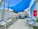 Shared outdoor patio with grills and seating at 5207 S Atlantic Ave # 1021, New Smyrna Beach, FL 32169