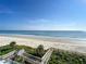 Stunning aerial view of beach, boardwalk, and ocean at 5207 S Atlantic Ave # 423, New Smyrna Beach, FL 32169