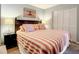 Bedroom with coastal decor and comfortable bedding at 5207 S Atlantic Ave # 423, New Smyrna Beach, FL 32169