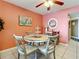 Charming dining area with table and chairs; coastal decor at 5207 S Atlantic Ave # 423, New Smyrna Beach, FL 32169