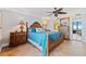 Spacious bedroom with king bed and wooden dresser at 5255 S Atlantic Ave # 1103, New Smyrna Beach, FL 32169