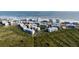 Aerial view of oceanfront community with lush landscaping and residential buildings at 5300 S Atlantic Ave # 17-206, New Smyrna Beach, FL 32169