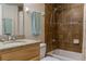 Clean bathroom with granite countertop and shower at 5300 S Atlantic Ave # 17-206, New Smyrna Beach, FL 32169