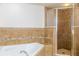 Bathroom with soaking tub and separate shower at 5300 S Atlantic Ave # 17-206, New Smyrna Beach, FL 32169