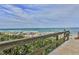 Wooden boardwalk leads to a beautiful beach with ocean views at 5300 S Atlantic Ave # 17-206, New Smyrna Beach, FL 32169