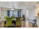 Dining area with light-colored table and chairs, view to balcony at 5300 S Atlantic Ave # 17-206, New Smyrna Beach, FL 32169