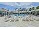 Relaxing pool area with numerous lounge chairs at 5300 S Atlantic Ave # 17-206, New Smyrna Beach, FL 32169