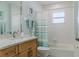 Clean bathroom with tub, shower, and updated vanity at 5300 S Atlantic Ave # 9-507, New Smyrna Beach, FL 32169