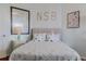 Serene bedroom with coastal decor and ample natural light at 5300 S Atlantic Ave # 9-507, New Smyrna Beach, FL 32169