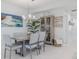 Bright dining room featuring a glass-top table and chandelier at 5300 S Atlantic Ave # 9-507, New Smyrna Beach, FL 32169